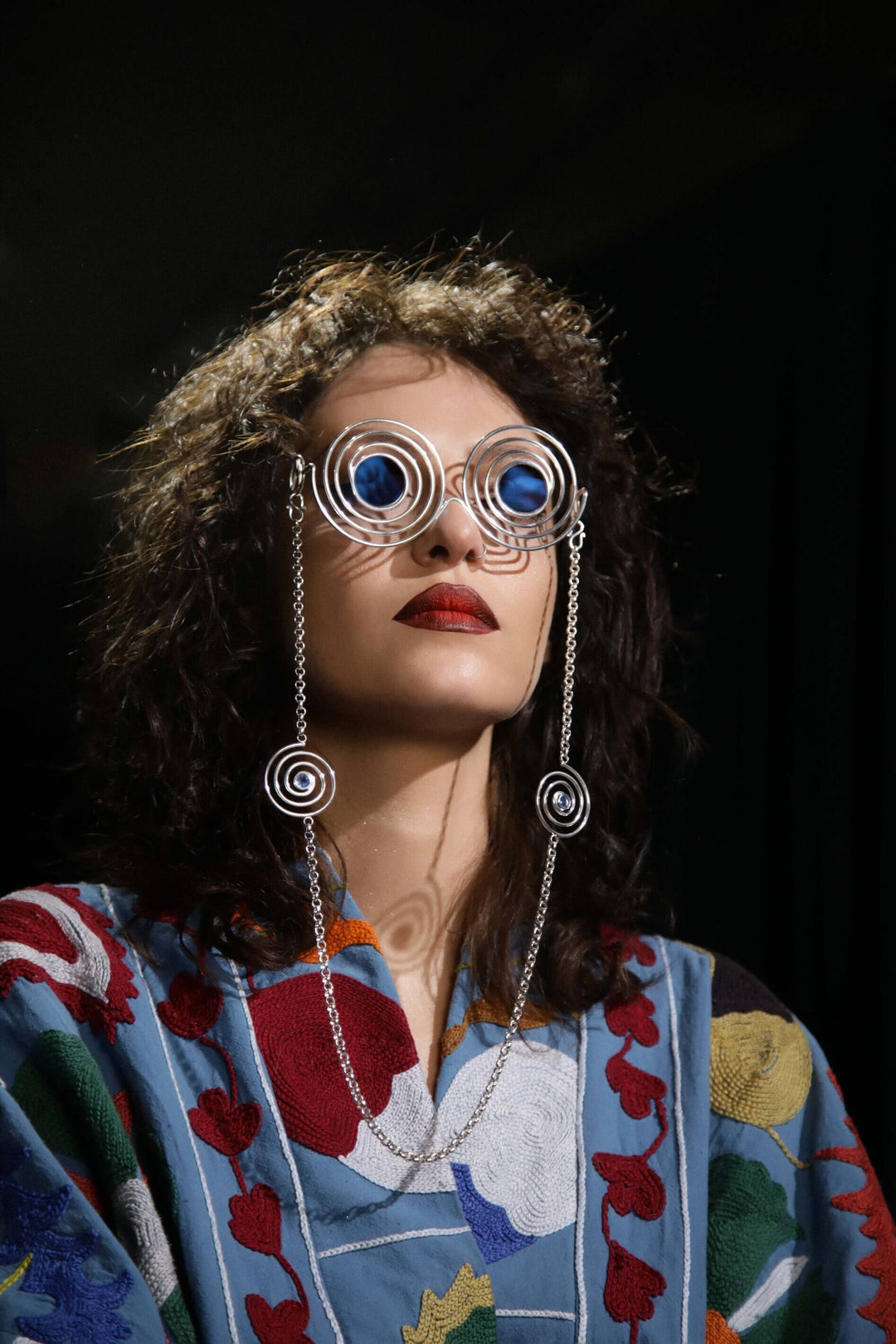 Avant-garde sunglasses Psychedelic Spirals, handmade in Sterling Silver 925 with removable chains featuring blue quartz spirals. Ideal for raves, parties, and fashion events, combining luxury and artistic design.