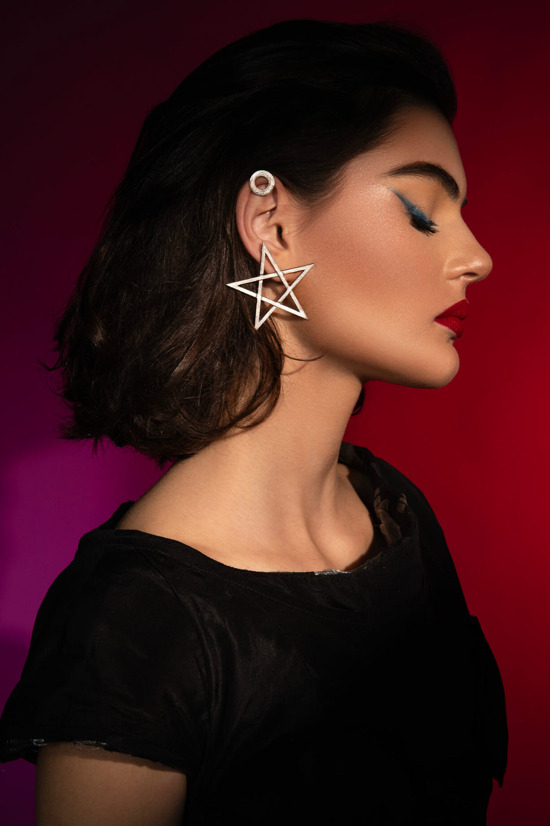 The Mystic Pentagram Earrings, a unique avant-garde statement accessory, is designed to empower dark feminine energy. Ethically handmade of Sterling Silver 925.