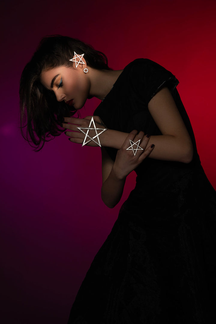 The Mystic Pentagram Earrings, a unique avant-garde statement accessory, is designed to empower dark feminine energy. Ethically handmade of Sterling Silver 925.