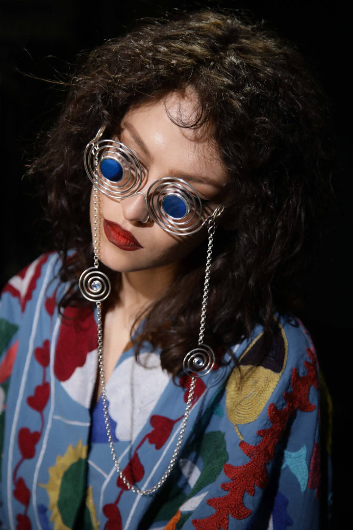 Avant-garde sunglasses Psychedelic Spirals, handmade in Sterling Silver 925 with removable chains featuring blue quartz spirals. Ideal for raves, parties, and fashion events, combining luxury and artistic design.