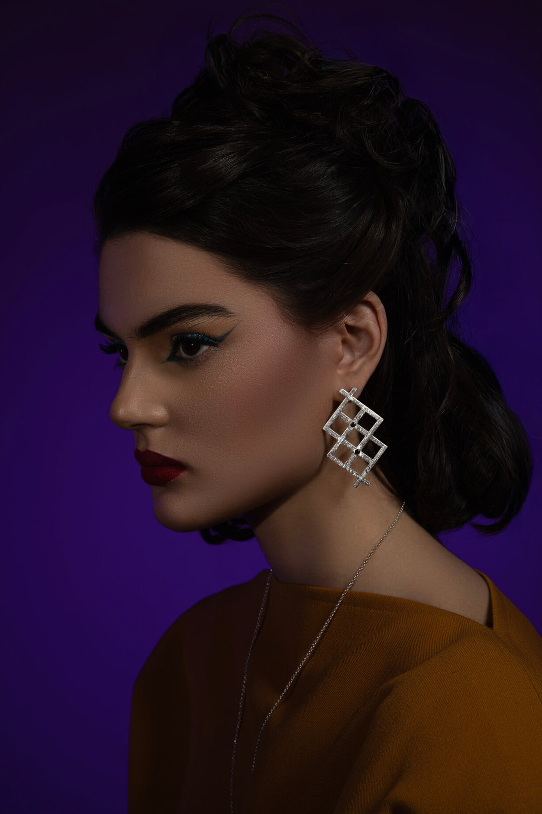 WishRune Earrings: Geometric avant-garde statement design with jet stones, inspired by runes believed to grant wishes. Wish it. Wear it. Own it.