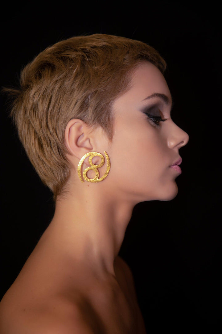 Unique Avant-garde statement Cancer Earrings ethically handmade of 18K Gold. #material_18k-gold