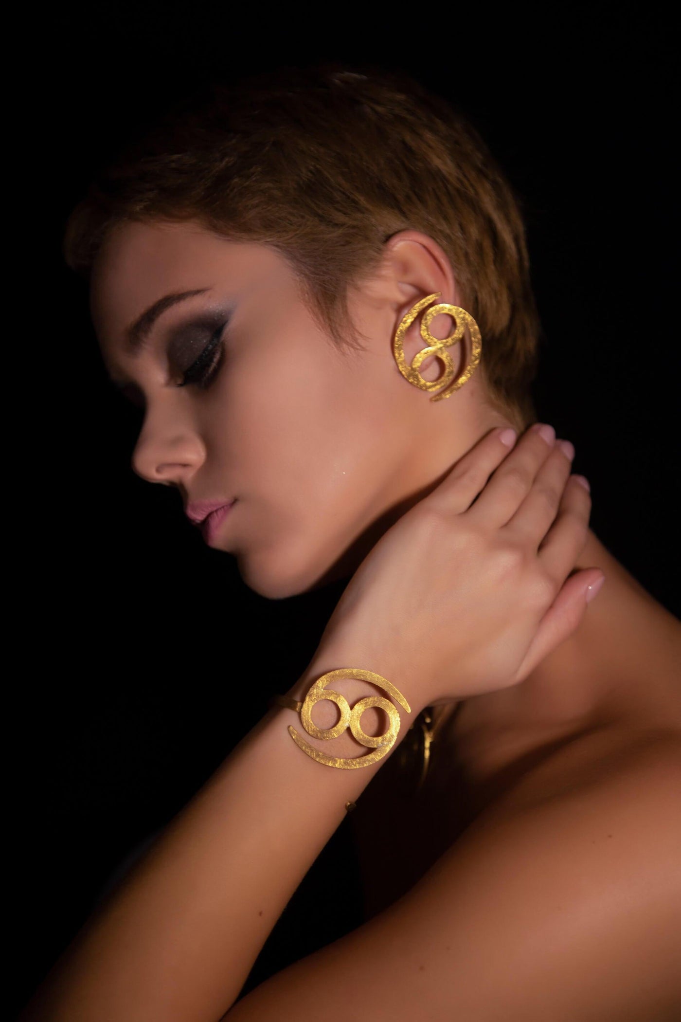 Unique Avant-garde statement Cancer Earrings & Bracelet ethically handmade of 18K Gold. #material_18k-gold
