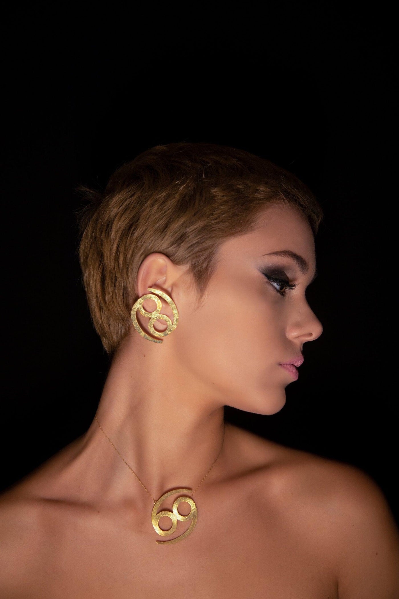 Unique Avant-garde statement Cancer Earrings & Necklace ethically handmade of 18K Gold. #material_18k-gold