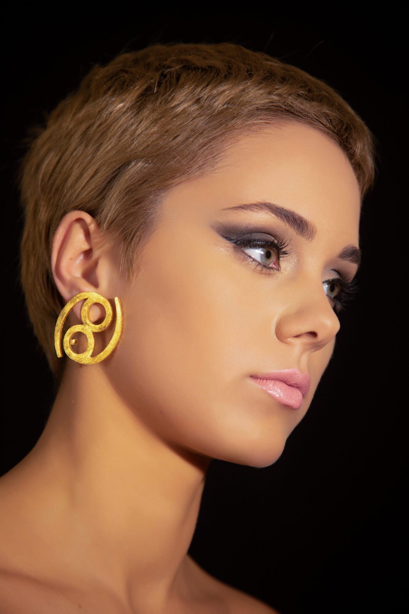 Unique Avant-garde statement Cancer Earrings ethically handmade of 18K Gold. #material_18k-gold